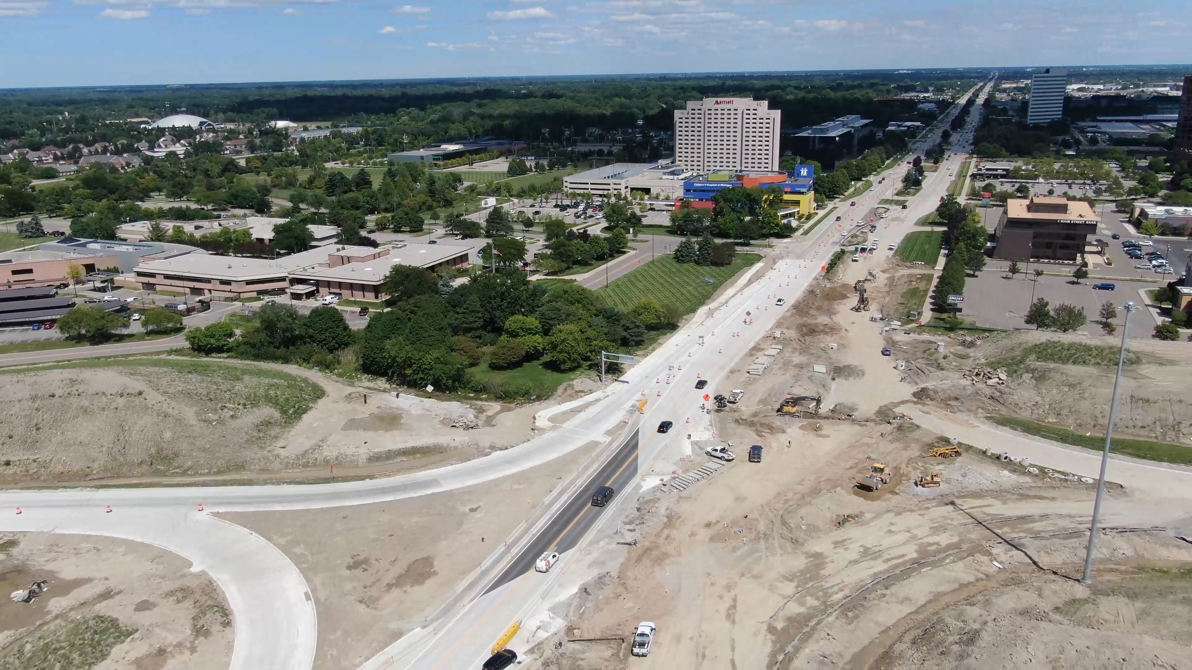 Aerial view of Big Beaver Road looking east.  Reconstruction of roadway interchange showing the base of the roadway in process.