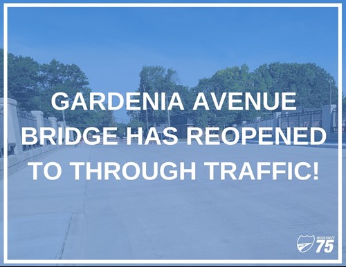 Street level photo of Gardenia Avenue with text overlay "Gardenia Avenue bridge has reopened to through traffic"